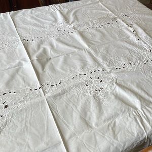 White cotton cutout floral pattern embroidery oval 66” x 97” tablecloth